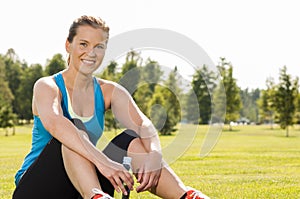 Happy woman jogger training in the park