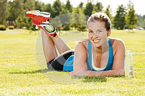 Happy woman jogger training in the park