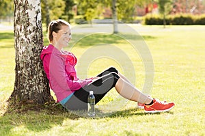 Happy woman jogger training in the park. Healthy lifestyle and p