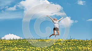 Happy woman jump for joy with laugh on nature spring