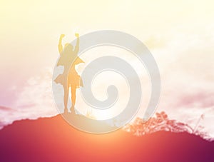 Happy woman jumping against beautiful sunset. Freedom, enjoyment concept