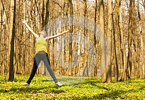 Happy woman jumping in spring nature