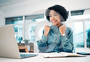 Happy woman, laptop and fist pump in winning, promotion or success for bonus or good news on office desk. Female person