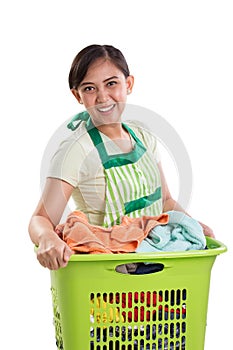 Happy woman and laundry basket