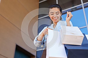 Happy Woman Leaving Shopping Mall