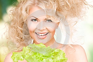 Happy woman with lettuce