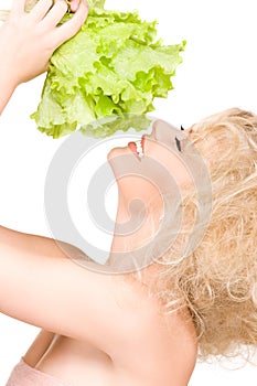 Happy woman with lettuce