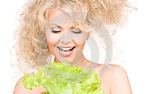 Happy woman with lettuce