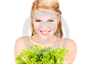 Happy woman with lettuce