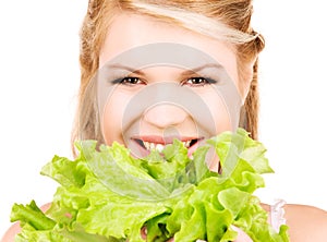 Happy woman with lettuce