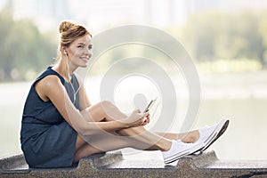 Happy woman listening music on line with headphones