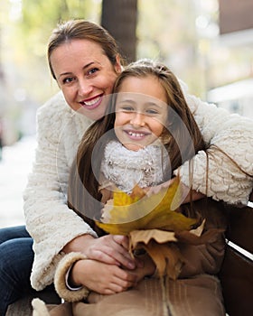 Happy woman with little daughter