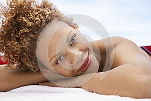 Happy Woman Lying On Massage Table