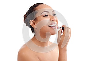 Happy woman, makeup and cosmetics with lipstick for beauty treatment on a white studio background. Female person