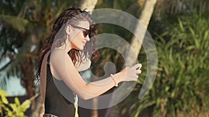 Happy woman making selfie on the beach