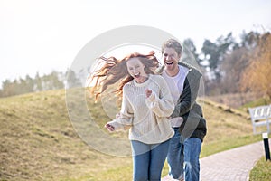 Happy woman and man actively having rest in nature