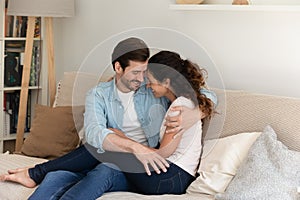 Happy woman and man hugging, touching foreheads, enjoying tender moment