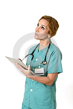 Happy woman md emergency doctor or nurse posing smiling cheerful with tablet pad