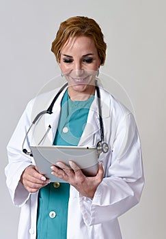 Happy woman md emergency doctor or nurse posing smiling using di