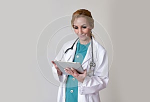 Happy woman md emergency doctor or nurse posing smiling using di