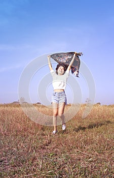 Happy woman in the meadow.