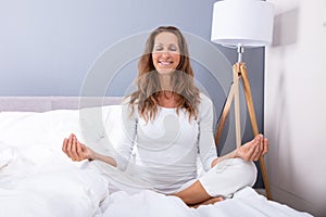 Happy Woman Meditating With Eyes Closed