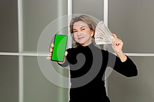 happy woman with money in hands and phone with green screen, SHOTLISTbanking,