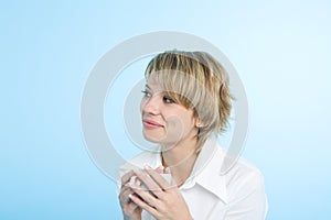 A happy woman at morning with a cup of coffee