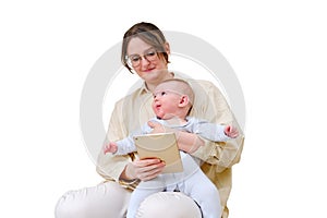 Happy woman mother with infant baby watching in digital tablet while