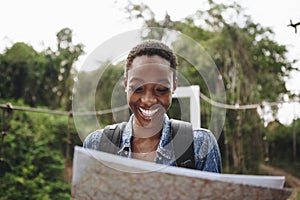 Happy woman navigating with a map photo