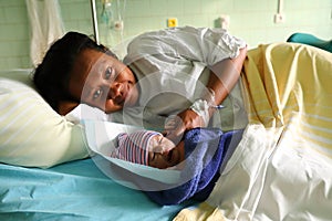 Happy woman with newborn baby