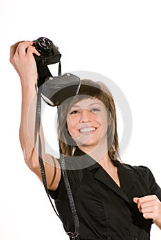 Happy woman with old camera