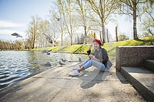 Happy woman outdoors. Stylish blonde woman