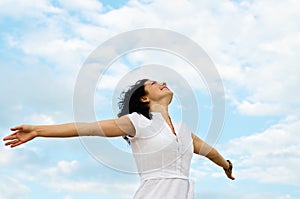 Happy woman with outspread arms photo