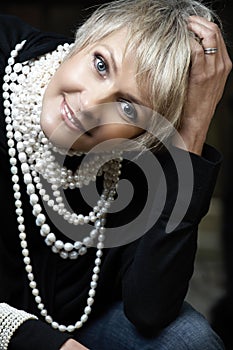 Happy woman with pearls photo