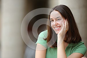 Happy woman with perfect smile looking at side