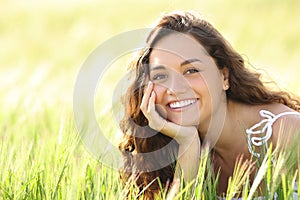 Happy woman with perfect smile in a wheat field