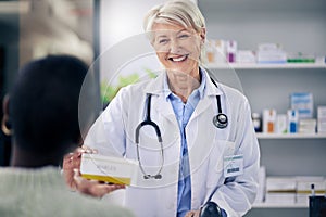 Happy woman, pharmacist and medicine box for patient, pills or prescription over the counter at pharmacy. Female person