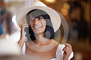 Happy woman, phone call and fashion with a hat while talking and having a conversation with smile on face for network