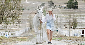 Happy woman, phone call and walking horse for communication or conversation in the countryside. Female person, farmer or