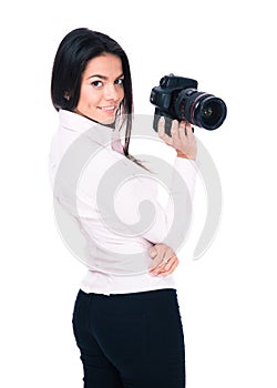 Happy woman photographer holding camera