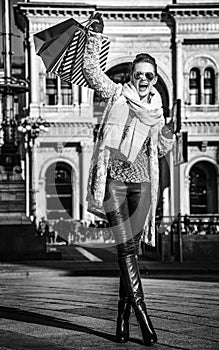 Happy woman at Piazza del Duomo in Milan, Italy rejoicing