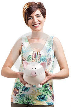 Happy woman with a piggy bank
