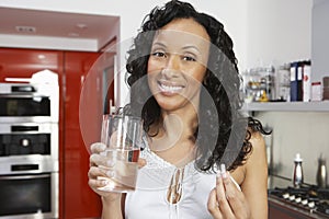 Happy Woman With Pill And Glass Of Water