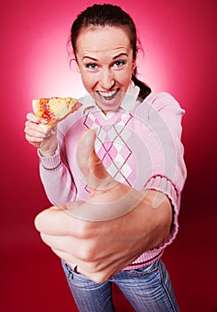 Happy woman with pizza showing thumbs up