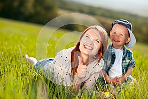 Happy woman playing with boy