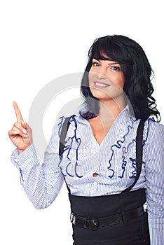 Happy woman pointing to copy space