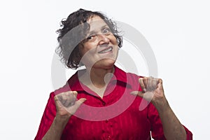 Happy woman pointing to herself, horizontal