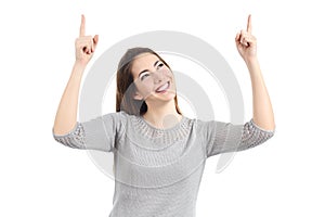 Happy woman pointing up with both hands photo
