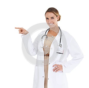 Happy woman, portrait or doctor pointing at mockup space isolated on white background in studio. Marketing, advertising